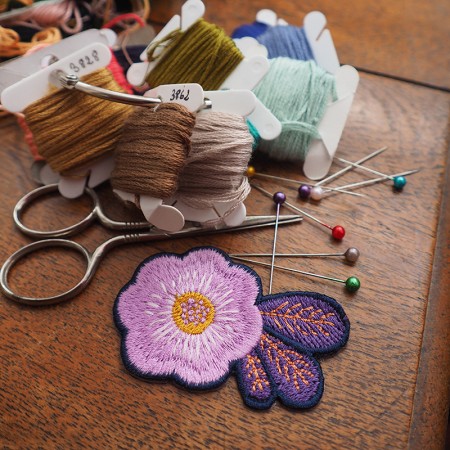 Embroidered iron-on patch with Winter Rose pattern